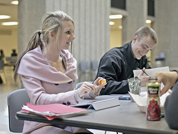photo of two people studying