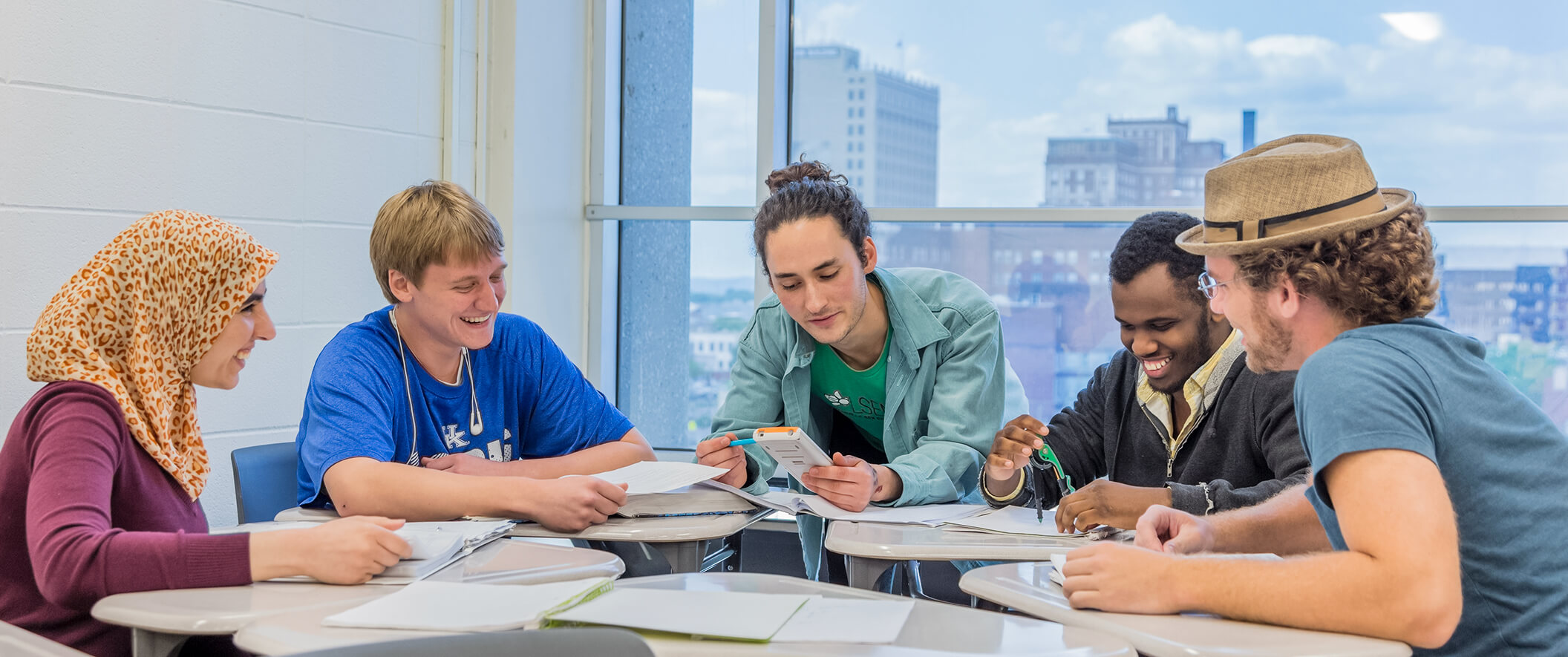 diverse students at student lounge table