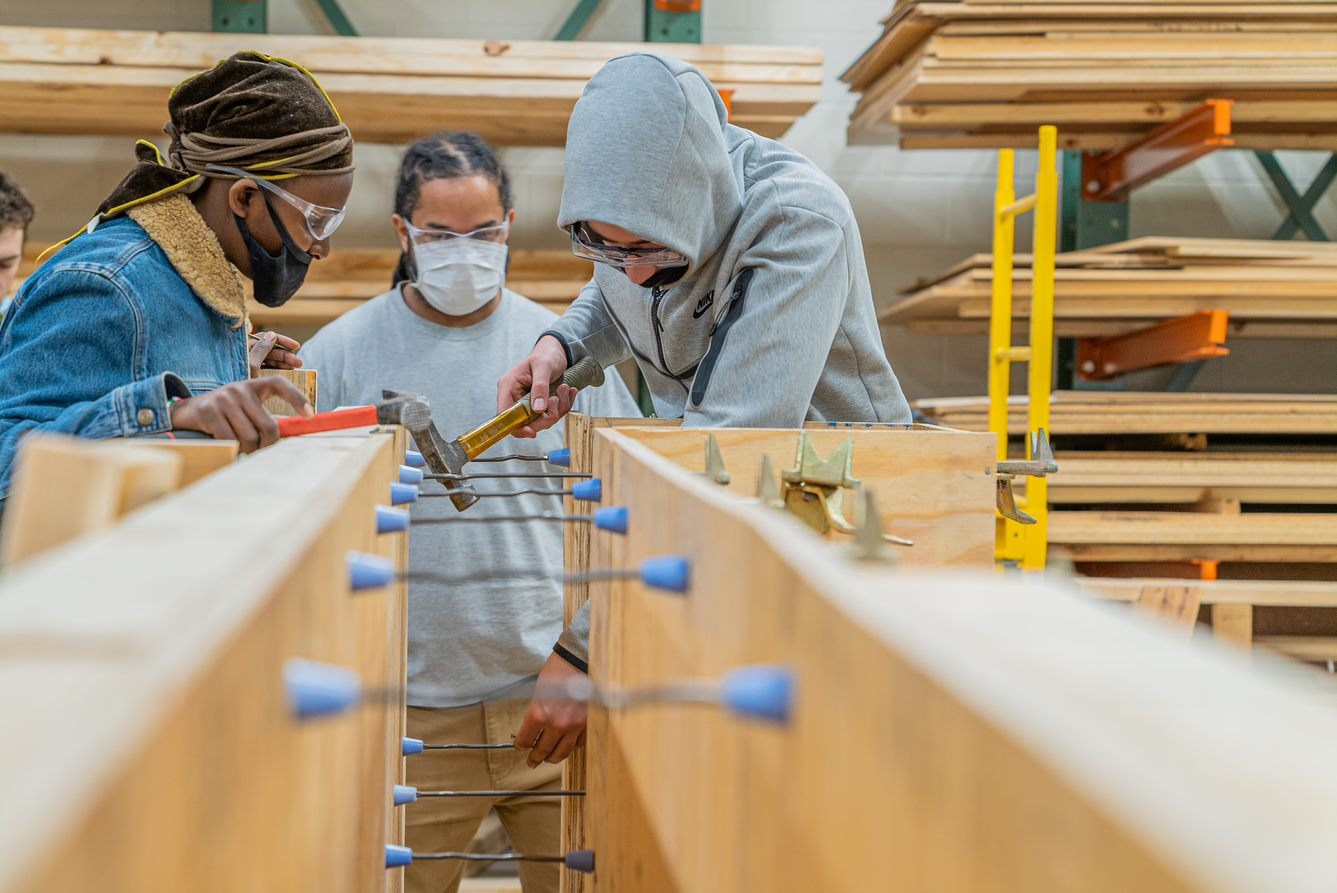 students practicing carpentry