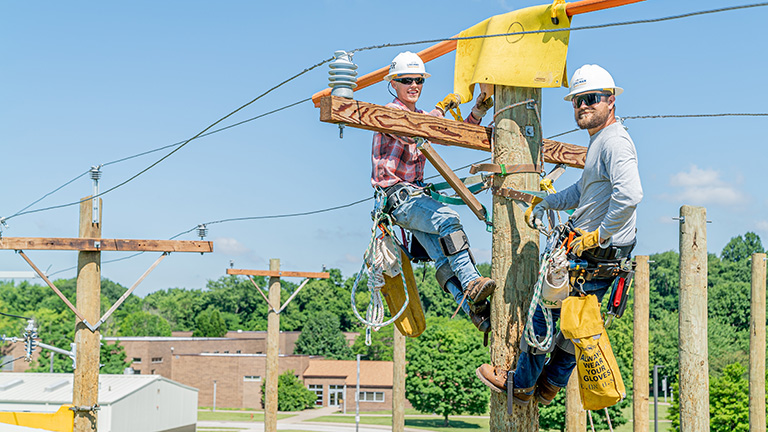 lineman up working on telephone lines