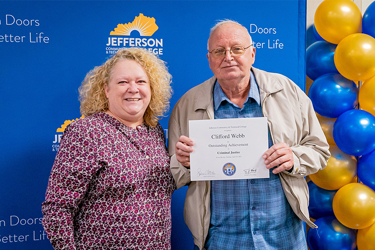 Webb with his diploma and a woman